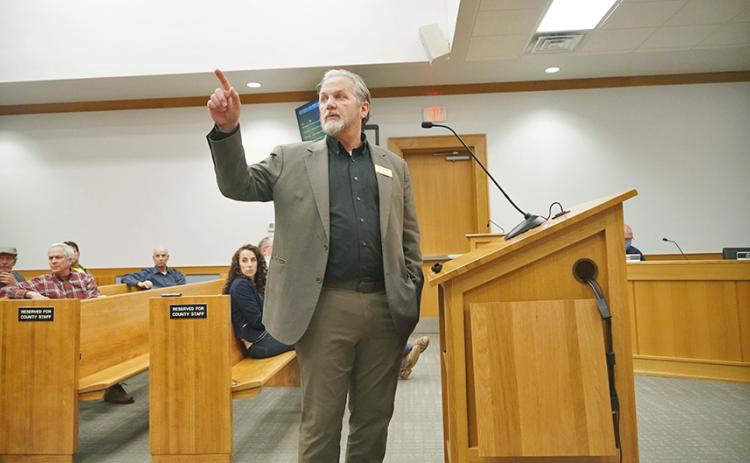Lumpkin County Planning Director Bruce Georgia points to posters spread throughout the boardroom showing different aspects of the developing land use plans with sections for citizens to write their comments alongside for consideration.