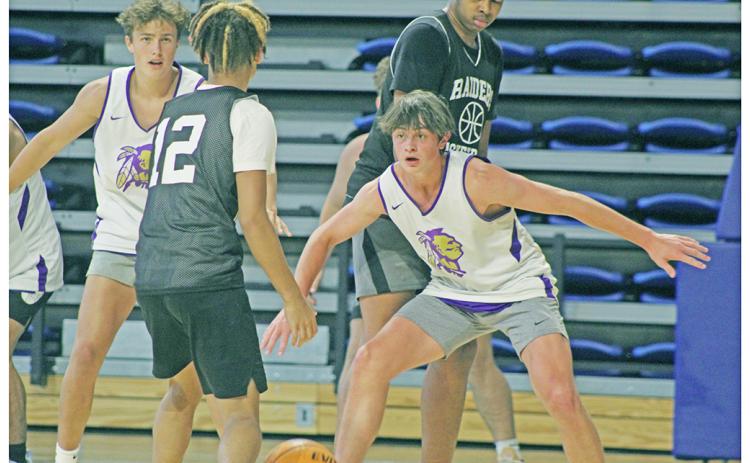 LCHS Boys Basketball players Jac Chambers (right) and Walker Scott focus in to try and make a play on the defensive end during UNG’s Team Camp last week.