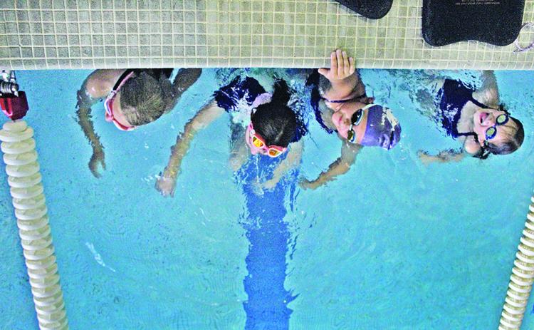 The Lumpkin County Parks and Rec Swim team is preparing to send 19 swimmers to compete at the GRPA State meet in Tifton this weekend. Pictured (from left): Lily Weber, Abagail Herrit, McKenzie Wiggington and Elsie Grizzle.