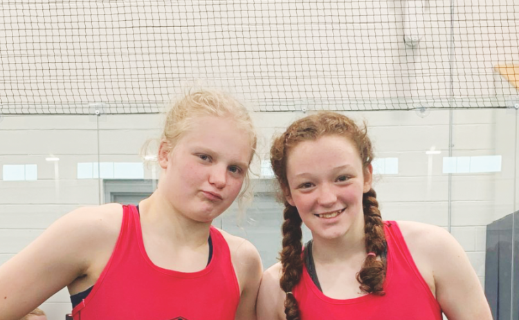 LCHS wrestlers—and sisters—Greta Garbuzovas (left) and Nora Garbuzovas both had standout performances at last week’s tournament.