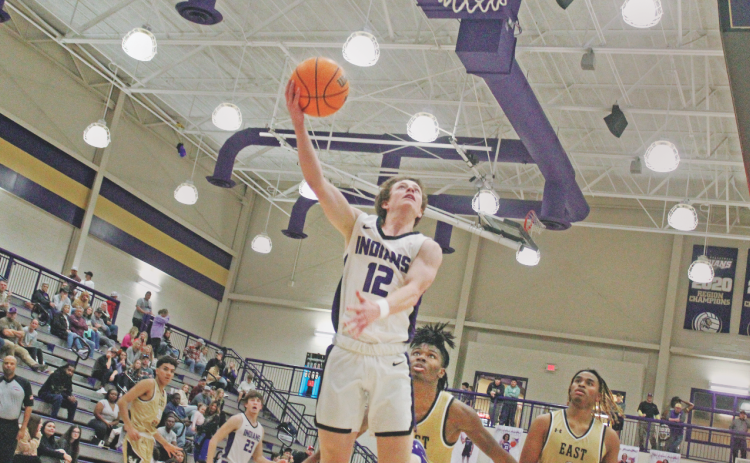 Lumpkin County junior Stephen Sherrill drives in for a shot versus East Hall during the Gold City Shootout last week.