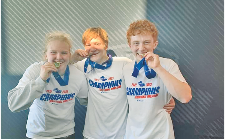 Lumpkin County High School had three wrestlers who became State Champions last week, including (from left) Greta Garbuzovas, Nathan Nielsen, and Austin Marshall.