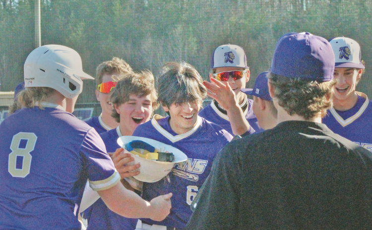 The Lumpkin County varsity baseball team celebrates Alejandro Narvaez’s home run against Towns County.
