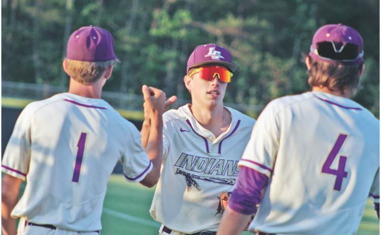 Lumpkin senior Landon Greene celebrates a diving catch during Lumpkin’s game versus Wesleyan.
