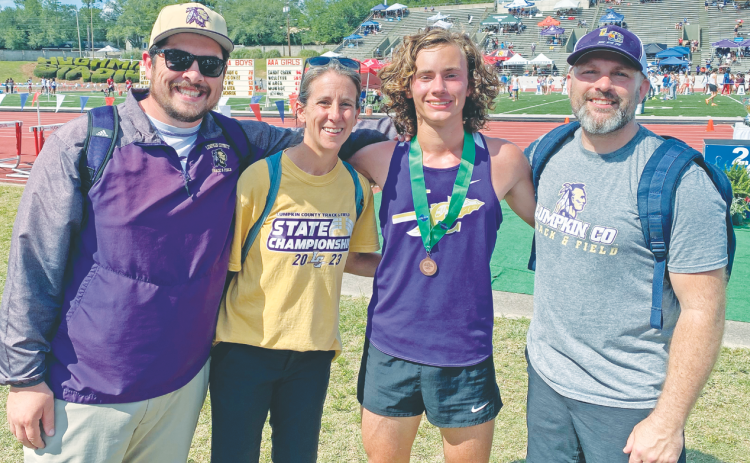 Head Coach William Mayfield, Assistant Coach Teri Hilchie, Wyatt Windham, and Assistant Coach Scott Mildenhall celebrate Lumpkin’s historic season together.