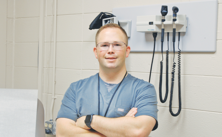 Kevin Jackson, FNP-C, is ready to see his next patient at the new Healthy Kids+ clinic. The facility, located in the former Lumpkin Elementary offices, is designed to meet primary health care needs for students, teachers and parents in the local school system.