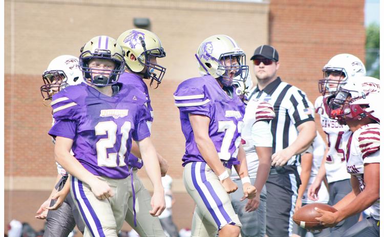 Dominick Alvarez and Xander Nielsen celebrate a big tackle for the Indians during this week’s game.