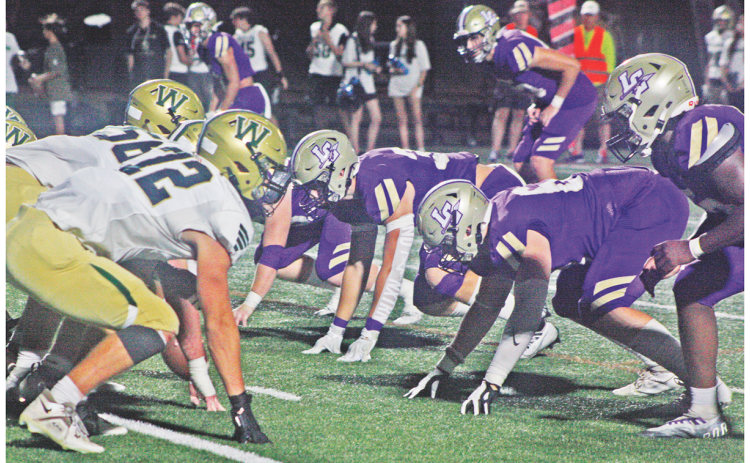 The Lumpkin defensive line squares off with the Wesleyan Wolves in last week’s game as the Indians came away with a 30-21 victory.