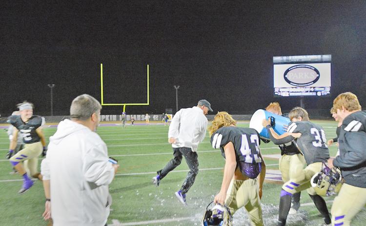 Head Coach Heath Webb gets a celebratory Gatorade bath after Lumpkin County’s victory over Gordon Lee on Friday night.