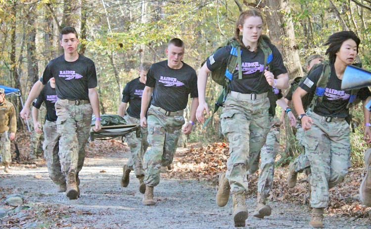 The Raiders squad competes in the Cross Country Rescue event during the All-Service State Championships.