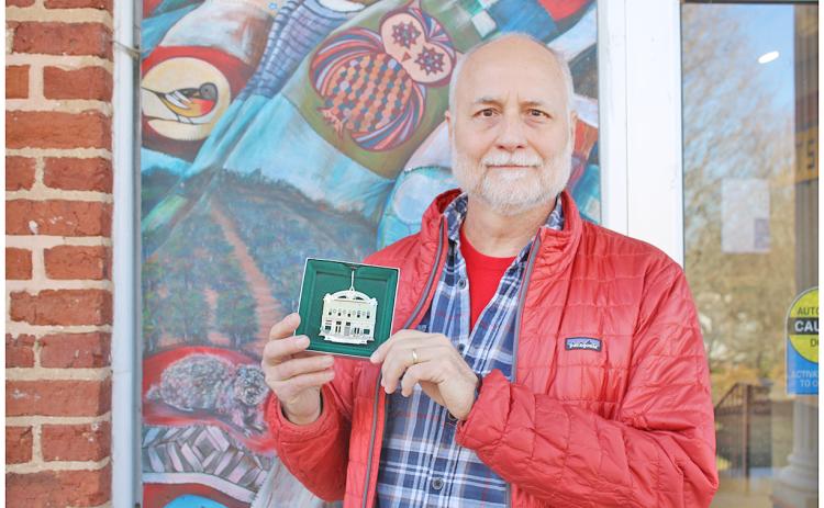 Dr. Jon Melhferber displays the 2023 Christmas In Dahlonega collector’s ornament he helped design.