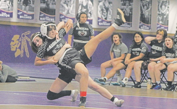 Lumpkin wrestler Cadence Grulla lands a huge takedown on her opponent.