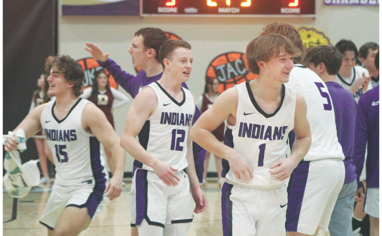 Teammates, from left, Colton Hamm, Stephen Sherrill and Luke Evans celebrate an Indians victory after a recent Lumpkin County game.