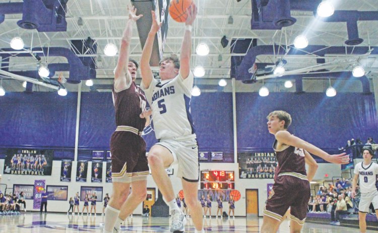 TJ Gaddis lands a layup during the teams game against Dawson County.