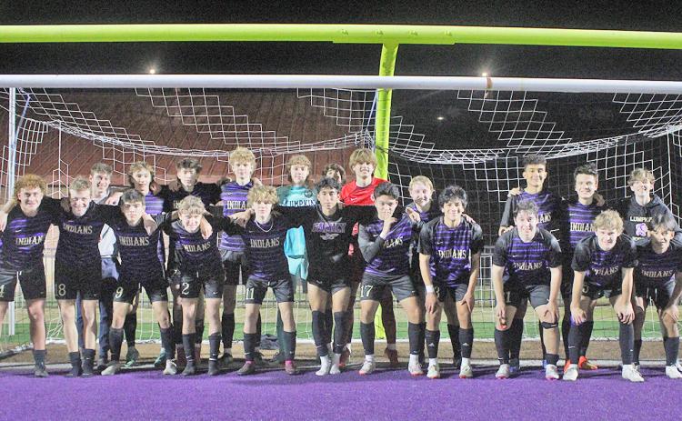 The LCHS varsity boys team celebrates following their big win over Calhoun.