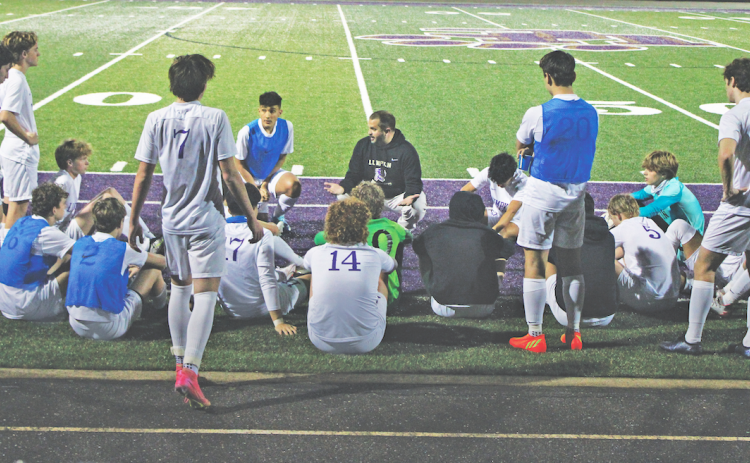 Head Coach Brent Howell rallies his Lumpkin County team during halftime.