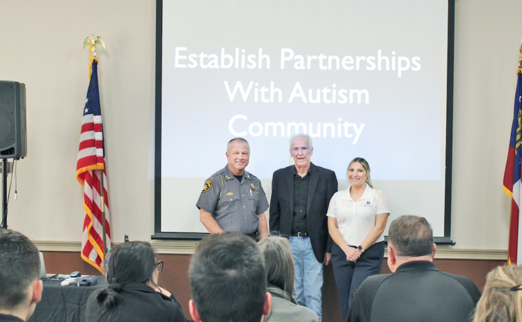Sheriff Stacy Jarrard, Dennis Debbaudt and Dr. Lyndsy Macri (left to right) spoke to law enforcement officers and other public servants in the Parks & Rec meeting room last Wednesday.