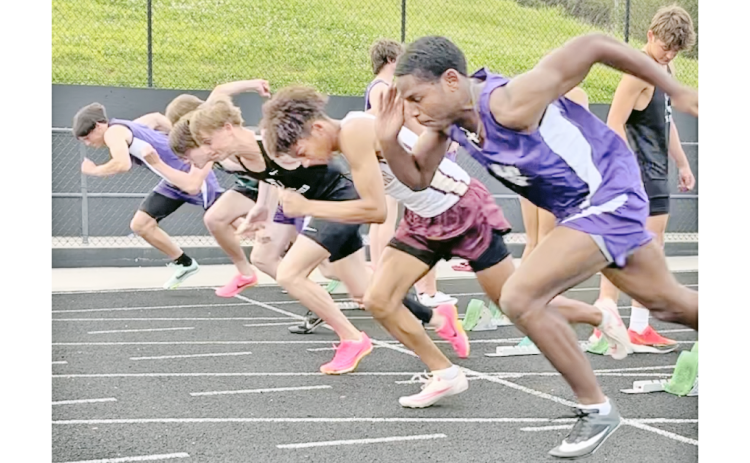 Runners Jalen Savoy and Cal Faulkner compete in the same heat during this week’s regional track meet against Gilmer.