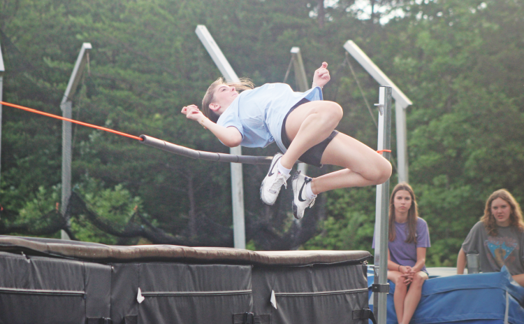 Lumpkin County athlete Brynli Gilreath demonstrates how to do a high jump during the recent summer camp.