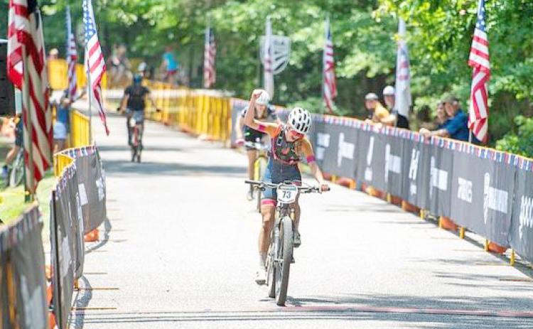Shiloh Claussen celebrates crossing the finish line at MTB Marathon Nationals. (submitted photo)