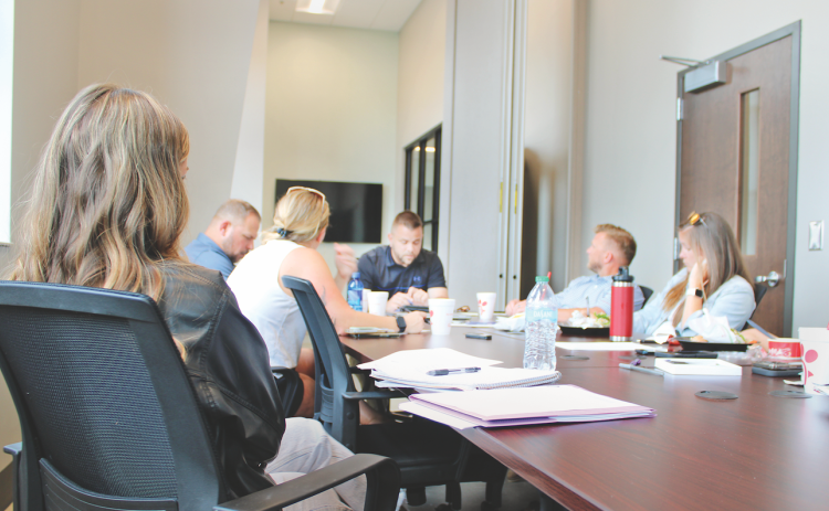 Parks & Rec Manager Tim Towe (center) reviews summer sports registration with members of the Citizens Advisory Committee at Pinetree Recreation Center.