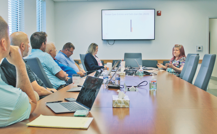 Lumpkin County Department of Family and Children Services Director April Arnold (right) explains her 2025 budget priorities to the Board of Commissioners during a recent special work session.