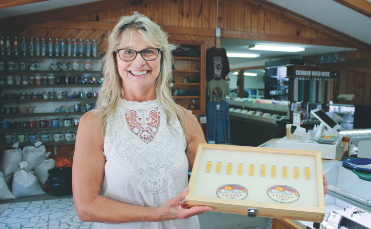 Crisson Gold Mine co-owner Tammy Ray displays local gold to be used on the Capitol Dome in Atlanta.
