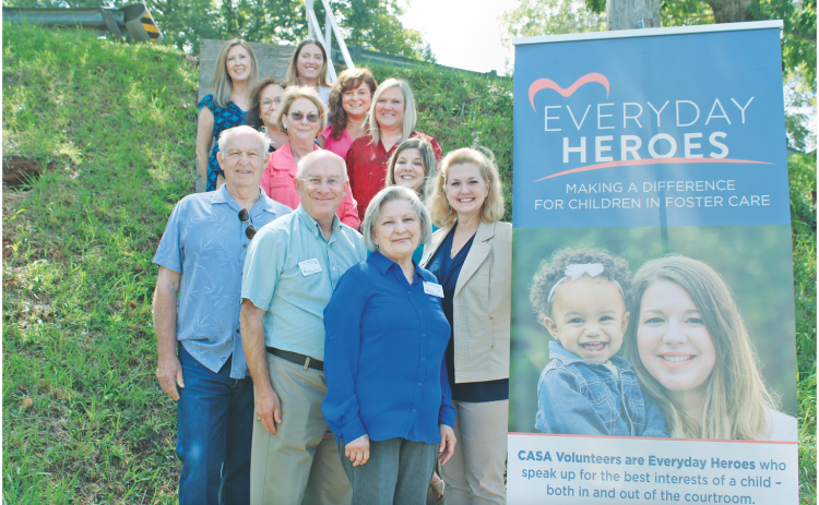 Pictured from CASA are Georgia Volunteer of the Year Pam McCampbell (front), Board Member John Seymour and Executive Director Della Lago (second row), Board Chair Ben Wallace and Advocate Supervisor Katie Dunlap (third row), Board Member Karen Powell and Administrative Assistant Debbie Schofield (fourth row), Outreach Coordinator Fran Parks and Georgia Executive Director Jen King (fifth row) and Georgia Program Operations Director Deidre Hollands and Georgia Marketing Director Rachelle Mosley (top row).