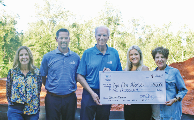 Pictured at the site of the future NOA shelter are (from left) Shelter Campaign Chair Tracy Unger, County Commissioner Tucker Greene, President Emeritus Chip Vaughan, NOA Executive Director Cara Ledford and NOA Board Chair Joanie Cullity.