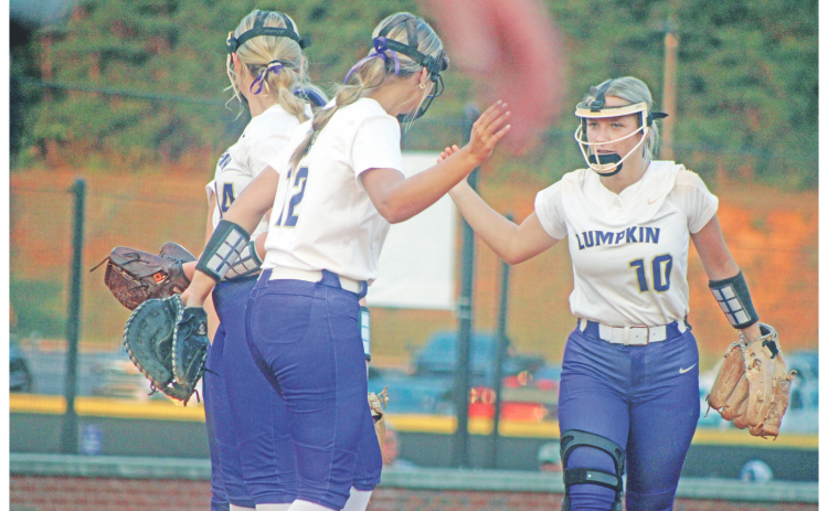 Lumpkin’s LaDalle Carpenter high-fives teammates as she takes the field against Dawson County.