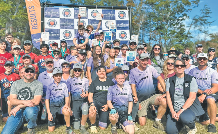 The Lumpkin Mountain Bike team gathers for a photo following a successful race at Yonah.