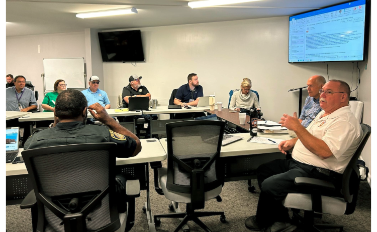 Local officials assembled in the bottom level of the downtown fire station last Thursday as they planned and prepared for the wind and rains of Hurricane Helene.