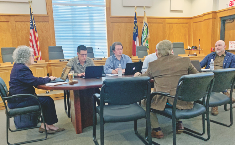 Members of the Dahlonega City Council discuss the merits of shifting back to the time-tested radio system for employee communication.
