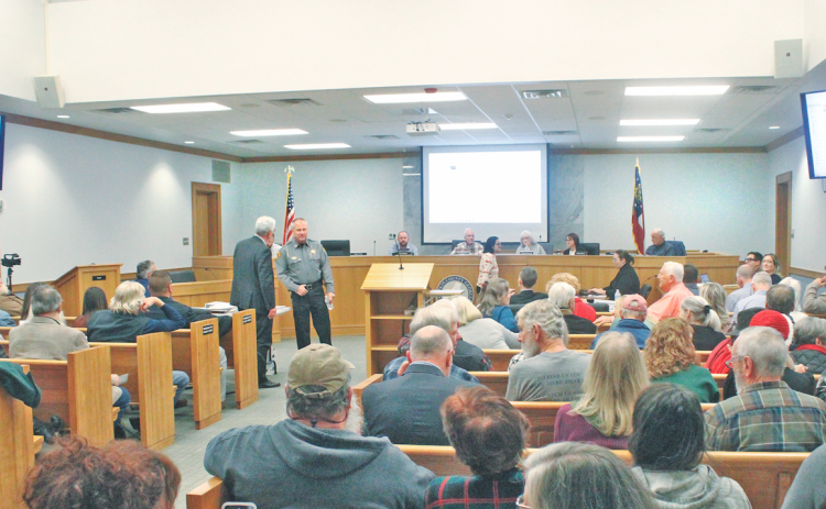 A packed crowd gathered in the Commissioner’s Boardroom last Monday night in anticipation of the DiVine Village appeal hearing. Ultimately, the Planning Commission voted to uphold an administrative denial of increased density for the development.