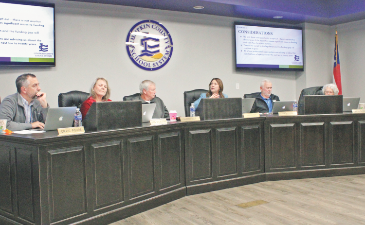 Superintendent Sharon Head explains her position on HB 581 as Board of Education members Craig Poore, Lynne Sylvester, Chairman Bobby Self, Jim McClure and Mera Turner weigh their options.