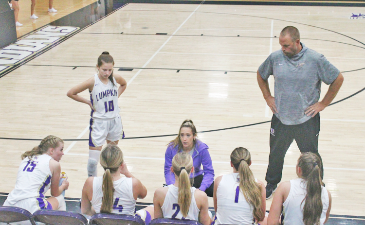 Head Coach Tess Wright talks things over with her Lumpkin County girls team.