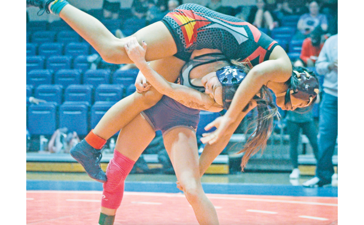 Cadence Grulla lands a big throw against an opponent. Grulla was one of several wrestlers to advance to Sectionals to represent Lumpkin. (photo by Eligha Roper)