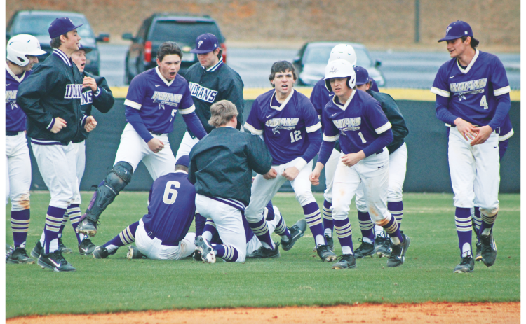 The Lumpkin County High School baseball team storms the field following their walk-off win against Fannin.
