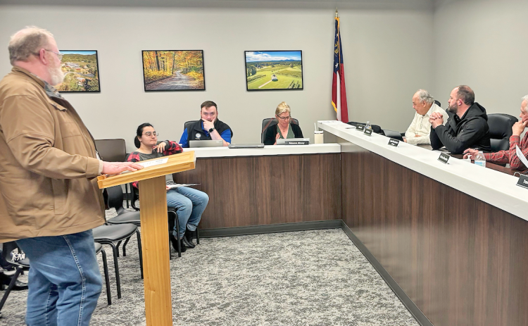 Larry Reiter addresses the Lumpkin County Planning Commission as the group entertains a variance request for a new convenience store on Auraria Road.