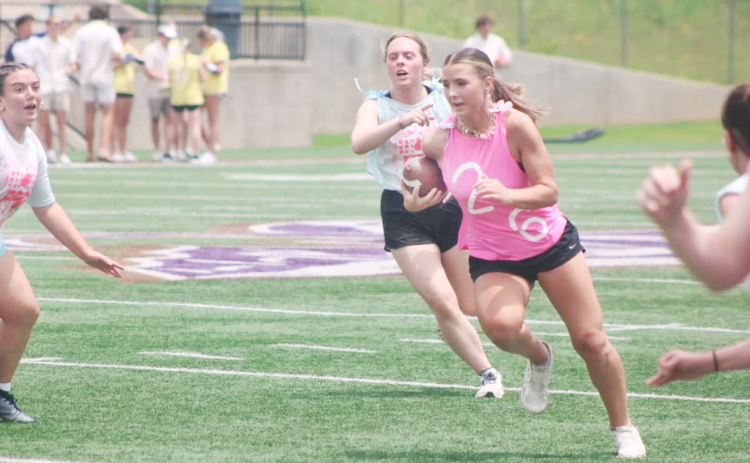 Lumpkin softball standout Cadence Ivey plows down the field during the recent powderpuff football game.