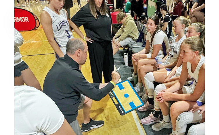 New Girls Basketball Head Coach Bryan Richerson talks strategy with the Lady Indians.