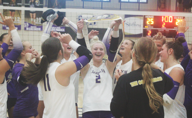 Averie Simmons celebrates alongside her teammates after she’s awarded the Player of The Week belt.