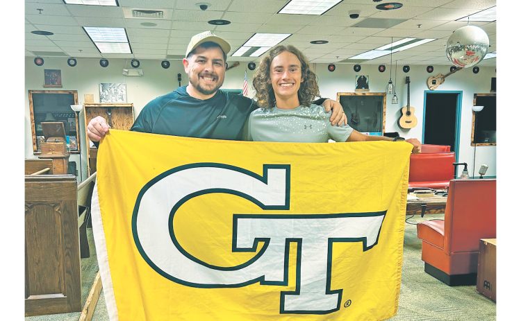 Will Mayfield gifts Wyatt Windham his Georgia Tech flag that flew in Afghanistan while he served in the U.S. Army National Guard.