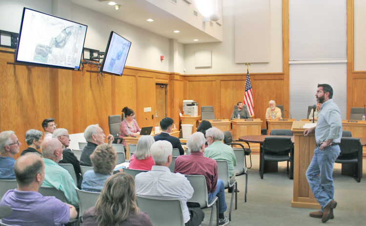 Warren Welch, Project Manager for The Overlook development, answers questions from the public about his amended PUD zoning proposal during a packed meeting of the Dahlonega Planning Commission.