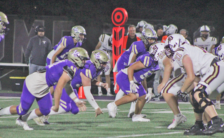 Lumpkin County’s defensive line faces off with Dawson’s offense.
