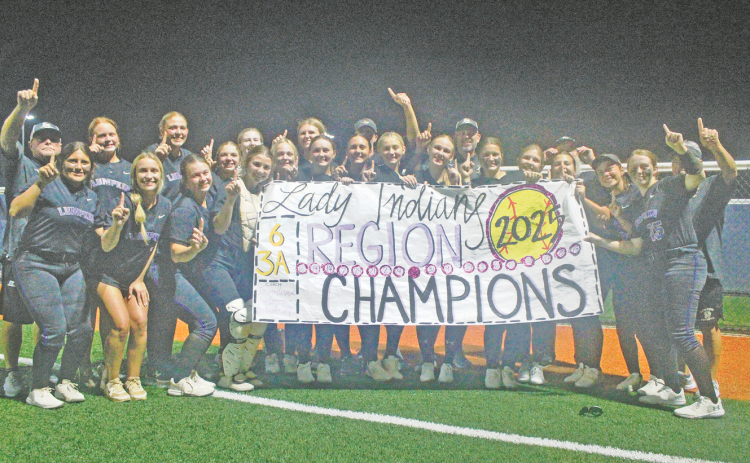 The Lady Indians softball team celebrates its Region Championship, following the big win over White County.