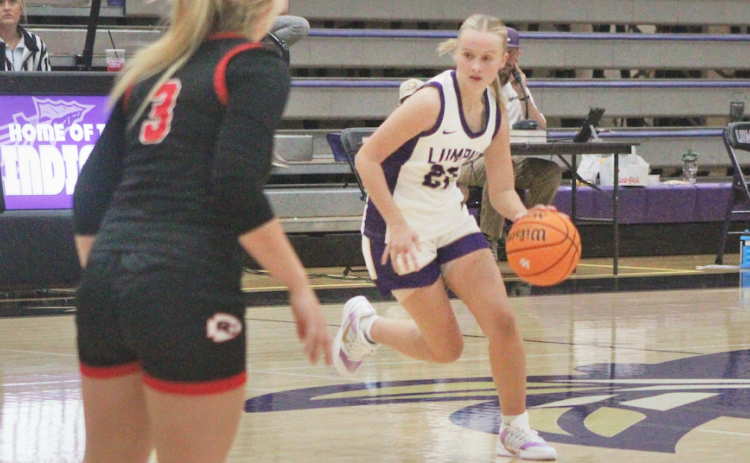 Anna Davis drives down the court for the Lady Indians.