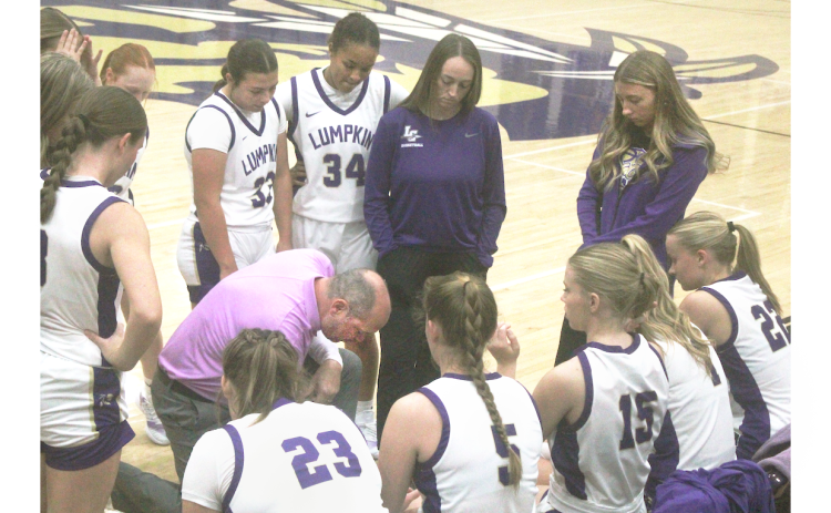 Head Coach Bryan Richerson draws up a game-plan for the Lady Indians during one of their recent games.