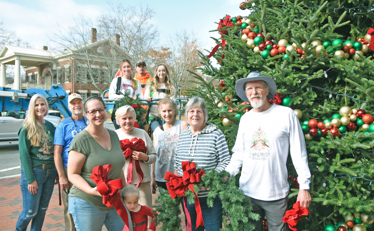A team of volunteers from the Old Fashioned Christmas Committee, along with City of Dahlonega employees, adorned the downtown tree with homemade decorations. Big crowds are expected in downtown Dahlonega for the annual Lighting of the Square this Friday. Local activities will last throughout the Christmas season.