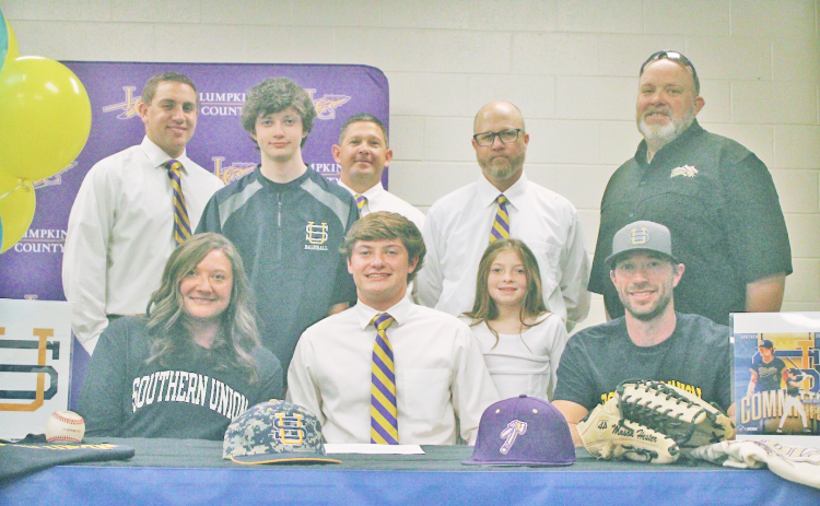 Mason Hester attends his signing day surrounded by coaches, friends and family.